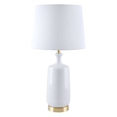 a white lamp with a gold base and a white shade on the top of it