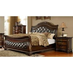 a bedroom with a bed, night stand and dressers in brown wood finish colors