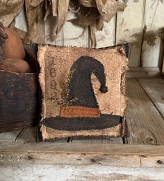 a decorative pillow sitting on top of a wooden table