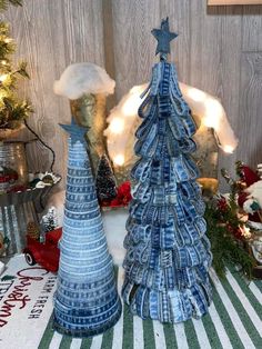 two blue christmas trees sitting next to each other