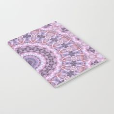 a spiral notebook with an abstract design on the front and back cover in pink, purple, and white