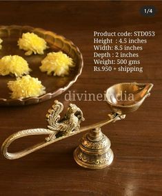 an ornate brass scale with yellow flowers on it and the price label for each item