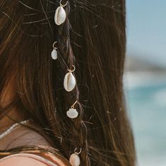 Our Cowrie Hair Charm offers a unique and stylish way to accessorize your mermaid hair. Its handcrafted shell design gives any look a touch of beachy vibes, perfect for a casual day out or a night on the town. With its lightweight design, it makes for comfortable and effortless styling and will be sure to turn heads. 3-pack Cowrie Shell removable charm 14k gold PVD Plated Hypoallergenic 6mm Hoop Tarnish Resistant Water Proof *each shell may vary slightly in size & color. Hair Styles For Shorter Hair, Hair Charm, Surf Style Clothes, Hair Charms, Beachy Vibes, Shell Design, Hair Wraps, Surf Style, Mermaid Hair