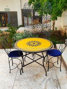 an outdoor table and chairs are set up outside