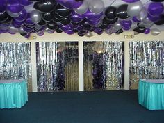 the room is decorated with balloons and streamers