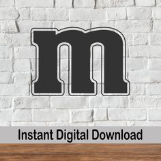 an image of the letter m on a white brick wall with text instant digital download