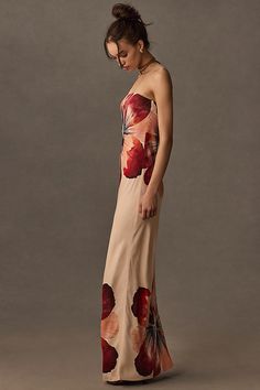 Offered in a stunning strapless silhouette, the Fleur puts a modern spin on the classic slip dress, complete with a slightly flared hem for making moves. | The Fleur Strapless Satin Maxi Slip Dress by Anthropologie in Beige, Women's, Size: Medium, Viscose Artsy Formal Dress, Dress With Heels Outfit, Viral Dress, Jaket Denim, Formal Fashion, Fantasy Dresses, Fitted Midi Dress, Strapless Floral Dress, Maxi Slip Dress