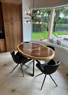 a dining room table with chairs around it