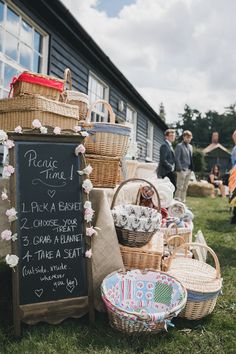 baskets and other items are on display in the grass