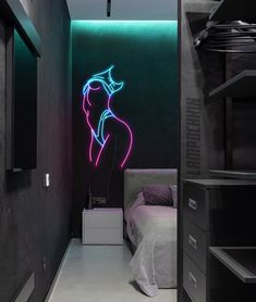 a bedroom with a neon light painting on the wall