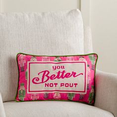 a pillow that says, you better not pout on the back of a chair