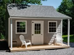 a small shed with two chairs on the porch