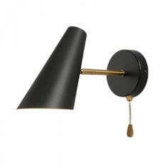 a black and gold wall light with an arm on the left side, and a white background