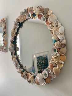 there is a mirror that has shells on it