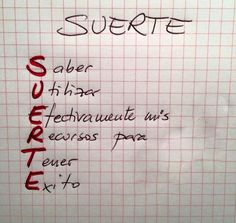 a sign that is written in spanish on a white board with red writing and black lettering