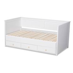 a white bed with drawers underneath it