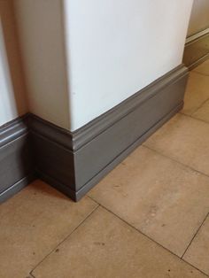 the corner of a room with tile flooring