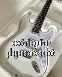 an electric guitar in a box with the words electric guitar players are so hot on it