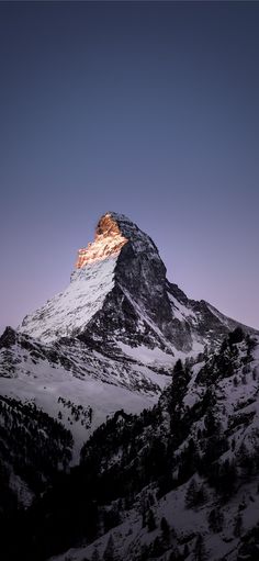 the top of a mountain with snow on it