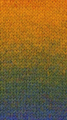 an orange, yellow and green knitted sweater