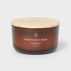 Fill your space with the warm essence of sandalwood and smoke using the 3-Wick Amber Glass Wooden Wick Sandalwood and Smoke Jar Candle 20oz from Threshold™. Housed in a sleek amber glass jar, this 20oz candle comes with three crackling wooden wicks that emit the vibe of a relaxing fireplace. The soy and paraffin wax blend offers approximately 51 hours of burn time, making this candle ideal for cozying up your evenings and setting an inviting mood. Threshold™: Looks like home, feels like you. Wood Candle, Cozy Candles, Amber Glass Jars, Glass Jar Candles, Wooden Wick, Candle Flames, Wood Candles, Tin Candles, Candle Holder Set