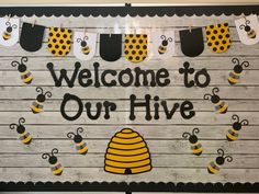 a welcome to our hive sign with bees