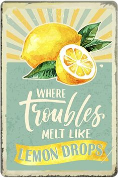 there are two lemons that are on this metal sign with the words, where troubles melt like lemon drops