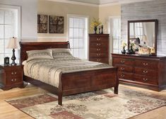 a bedroom scene with focus on the bed and dresser