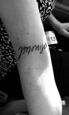 a woman's arm with the word mommy written in cursive writing on it