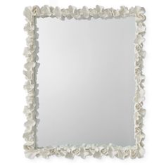 a square mirror with white flowers on it