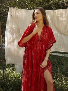 Switch to vacay mode anytime with the Goddess - Tie Dye Kaftan Maxi Dress in red coral. This undeniably sexy, breezy maxi dress will have you dreaming of the wind in your hair, the sound of the ocean waves, and the sand under your feet. Experience blissful comfort and breathability whether you’re at home or on vacay with the gorgeous flowy long dress and laid-back loose fit. Crafted in 100% soft, lightweight rayon, this dress features flawless tie-dye patterns and is perfect for tropical beachsi Red V-neck Dress For Vacation, Red Maxi Dress For Beach Cover-up, Red Boho Dress For Summer Beach Cover-up, Red V-neck Maxi Dress For Beach Party, Red V-neck Beach Dress For Vacation, Red Sundress For Beach Cover-up, Breezy Rayon V-neck Maxi Dress, Red V-neck Beach Dress For Beach Season, Red V-neck Beachwear Dress