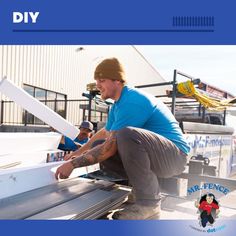 a man is working on the side of a boat with his hands and legs extended