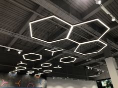 the ceiling is decorated with hexagonal lights