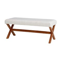 a wooden bench with a white upholstered seat