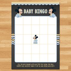 a mickey mouse baby shower mat with the words baby bingo written in black and white