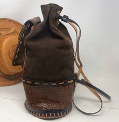 "17\" in height/7\" across bottom/15\" strap drop Separates into two can be worn as a backpack/smoke free environment/clean interior/" Brown Tote-shaped Bucket Bag For School, Vintage Leather Bucket Bag With Large Capacity, Leather Saddle Bag With Adjustable Strap For Outdoor, Brown Saddle Bag Satchel For Outdoor, Brown Satchel Saddle Bag For Outdoor, Brown Bucket Shoulder Bag For School, Vintage Shoulder Bag Standard Backpack For Everyday, Vintage Everyday Backpack Shoulder Bag, Vintage Everyday Shoulder Bag Backpack