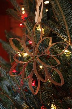 a christmas ornament hanging from the top of a tree