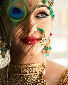 an instagram page with a woman's face and peacock feathers