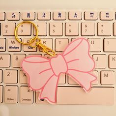 Get this beautiful Coquette Bow Keychain for the lady in your life who loves the coquette aesthetic! Accessorize your keys with this pretty pink bow keychain with a gold lobster claw and key ring.  Specifics: This pink pastel acrylic bow is 2.97'' x 2.21'' in size. It's the perfect size that fits easily in the palm of your hand. The gold hardware is 2.2'' in length. Add your keys and other charms to your keychain to personalize your look.  Giftable: Makes a great gift for friends and family for birthdays, Valentine's Day, Christmas, anniversaries, graduations and other special occasions. Perfect for those in your life who love cute bows and the coquette aesthetic. Pink Gadgets, Preppy Christmas Gifts, Charm Aesthetic, Aesthetic Keychain, Bow Keychain, Keychain Pink, Pastel Bows, Bow Charm, Preppy Christmas