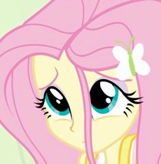 a pink pony with long hair and big eyes looking at the camera while wearing a flower in her hair