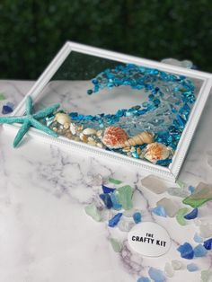 the crafty kit is made with sea glass and seashells, including starfish