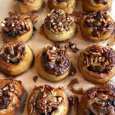 a bunch of pecans sitting on top of doughnut holes