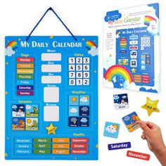 a child's hand holding up a blue calendar with stickers and magnets