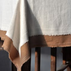 a close up of a chair with a table cloth on it