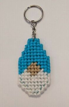 a blue and white beaded key chain