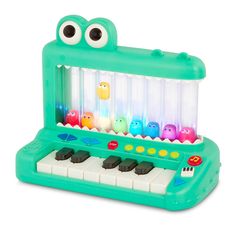 an electronic toy with eyes on it's face and keys in the shape of a piano