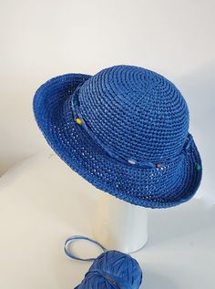 a blue hat sitting on top of a white table