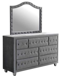 a dresser with a mirror on top of it and drawers below the dresser is an upholstered design