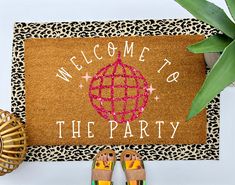 a welcome mat that says welcome to the party