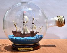 a glass globe with a ship in it